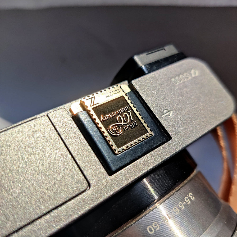 100th anniversary nikon hot shoe cover front view