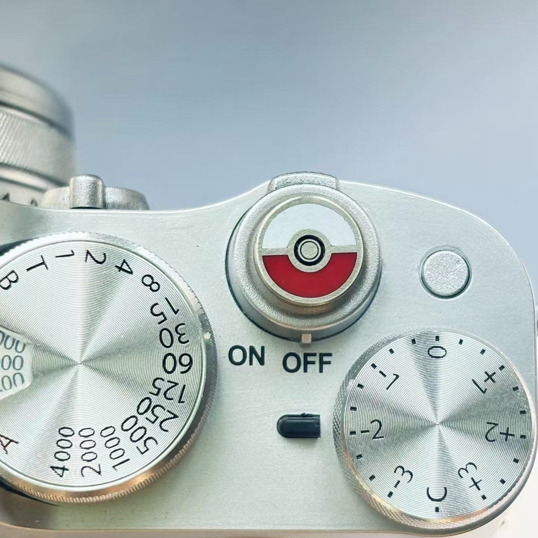 Nitendo poke ball camera shutter button on Fujifilm camera