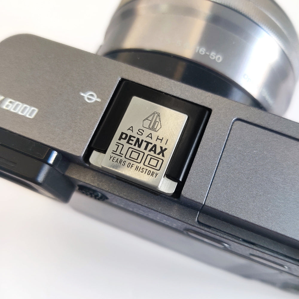 Pentax 100 hot shoe cover on camera