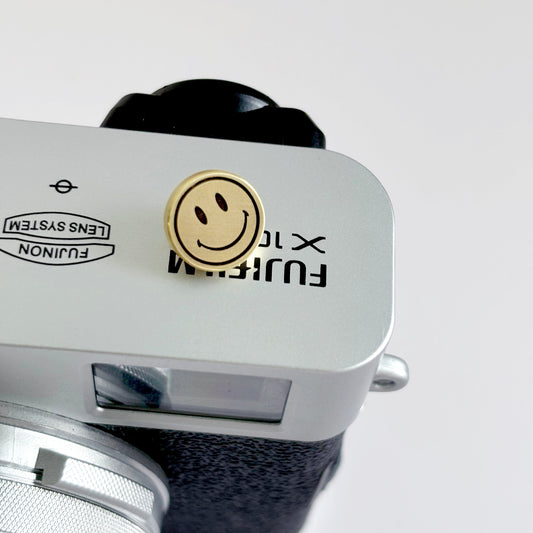 smile face fujifilm camera soft release button